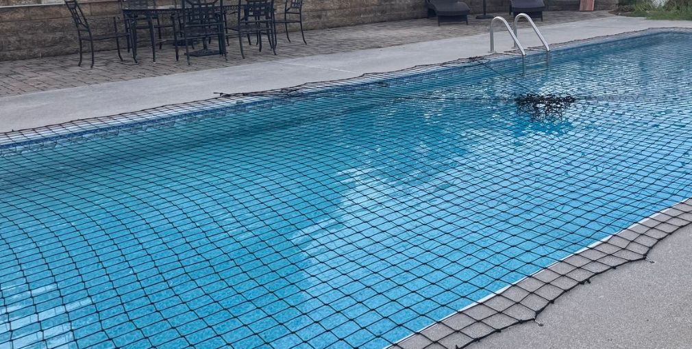 Swimming pool safety net installation for pool protection